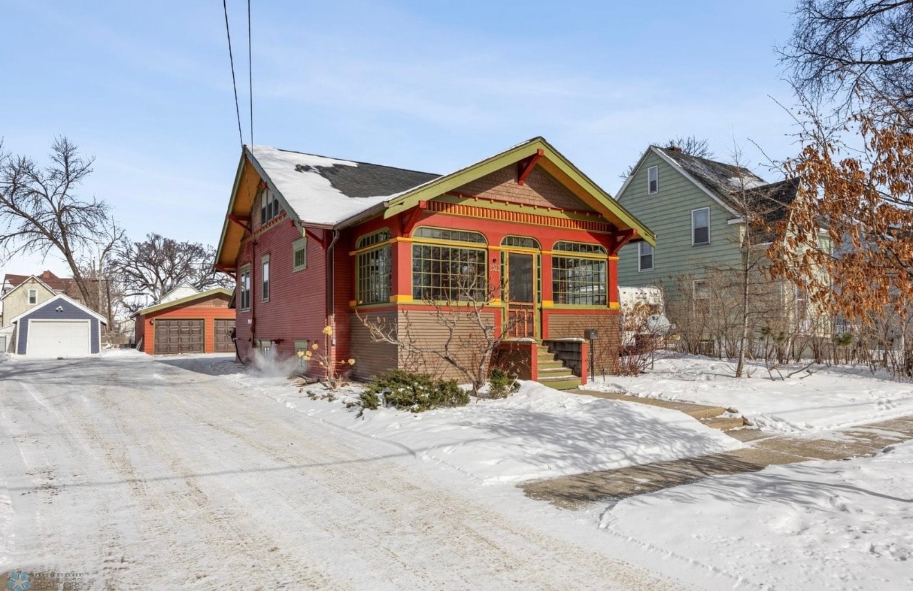 Exterior — colorful craftsman bungalow with arched windows, winter street view