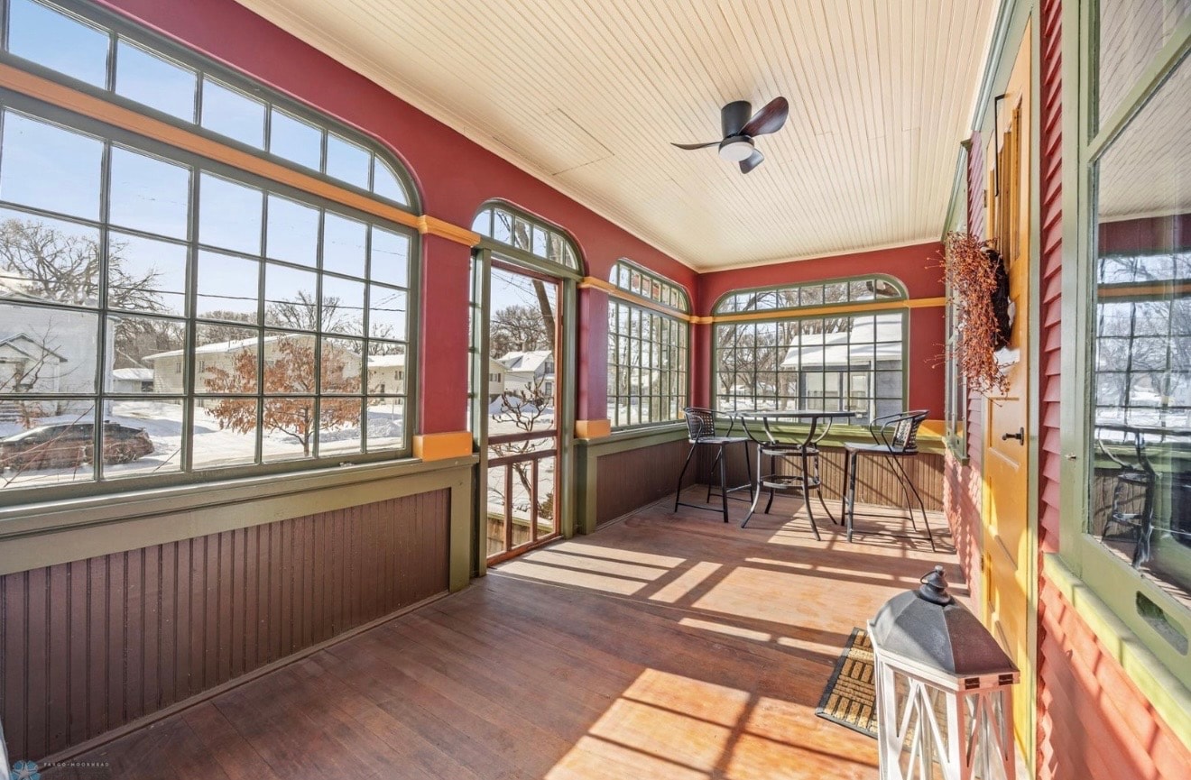 Interior — craftsman sunroom with arched windows and beadboard ceiling