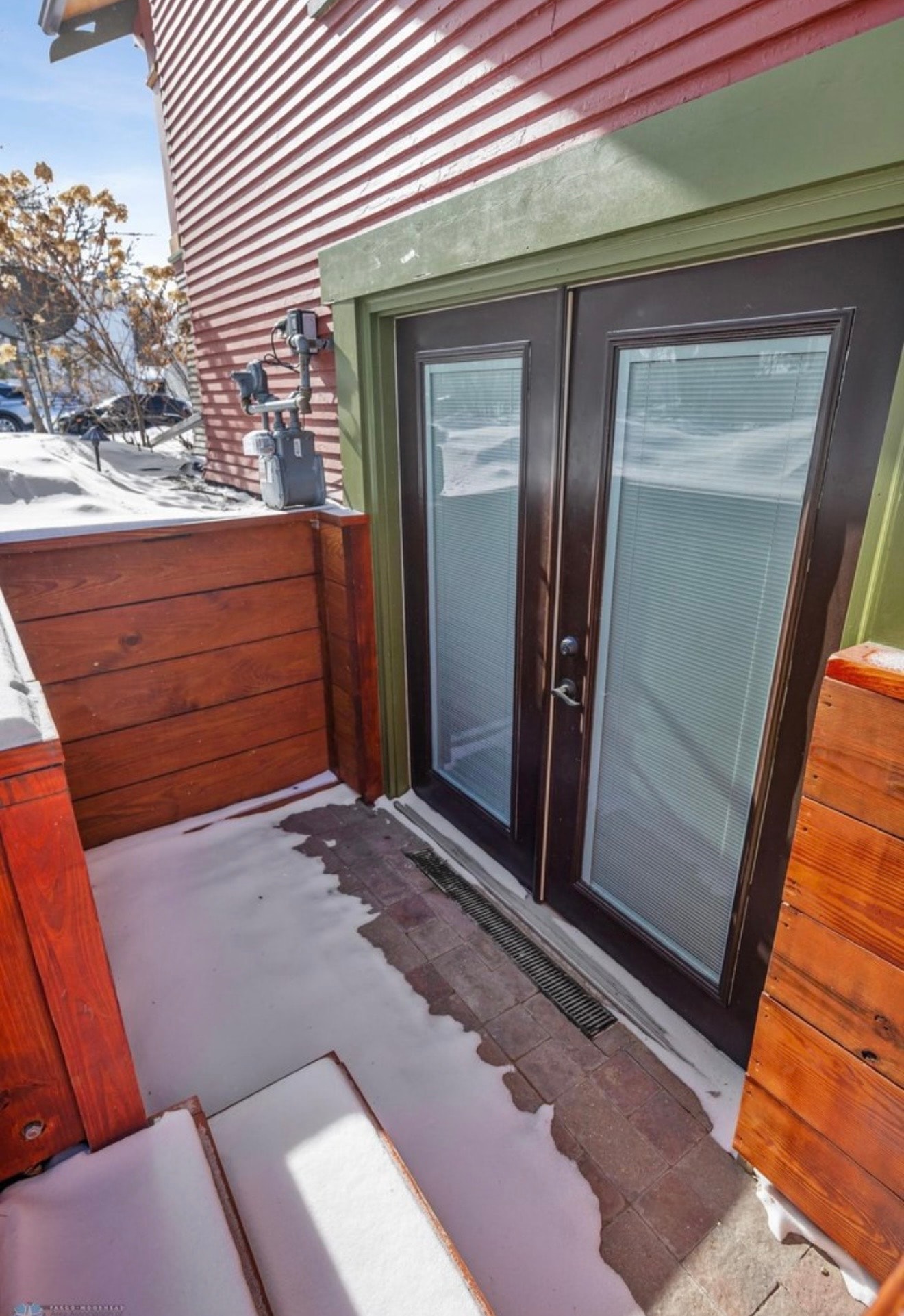 Exterior — craftsman entry with French doors and cedar deck