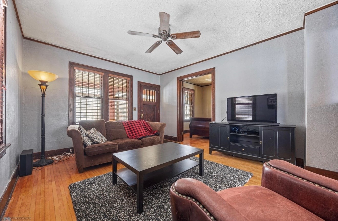 Living room — craftsman living room with wood trim and leather furniture