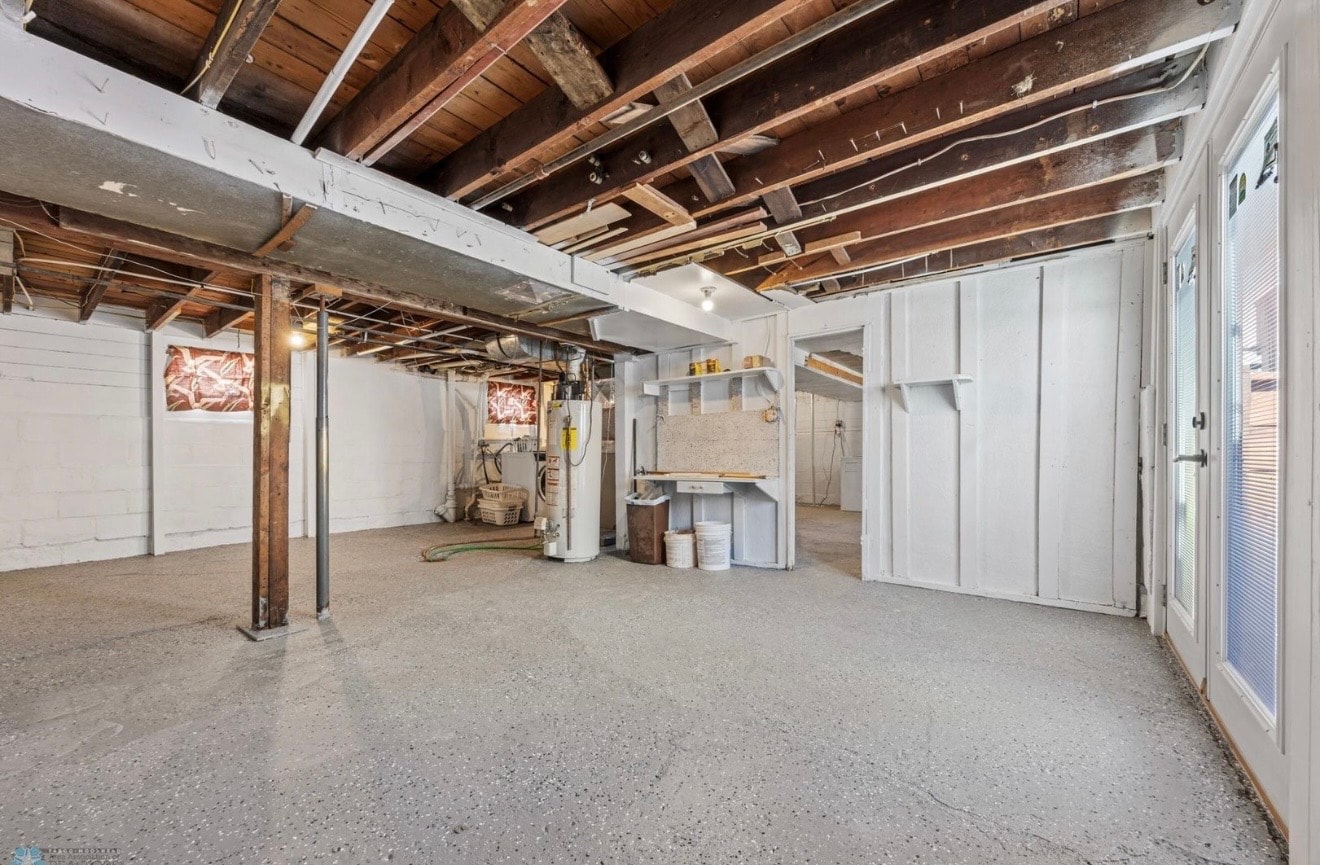 Miscellaneous — unfinished basement with exposed beams and storage areas