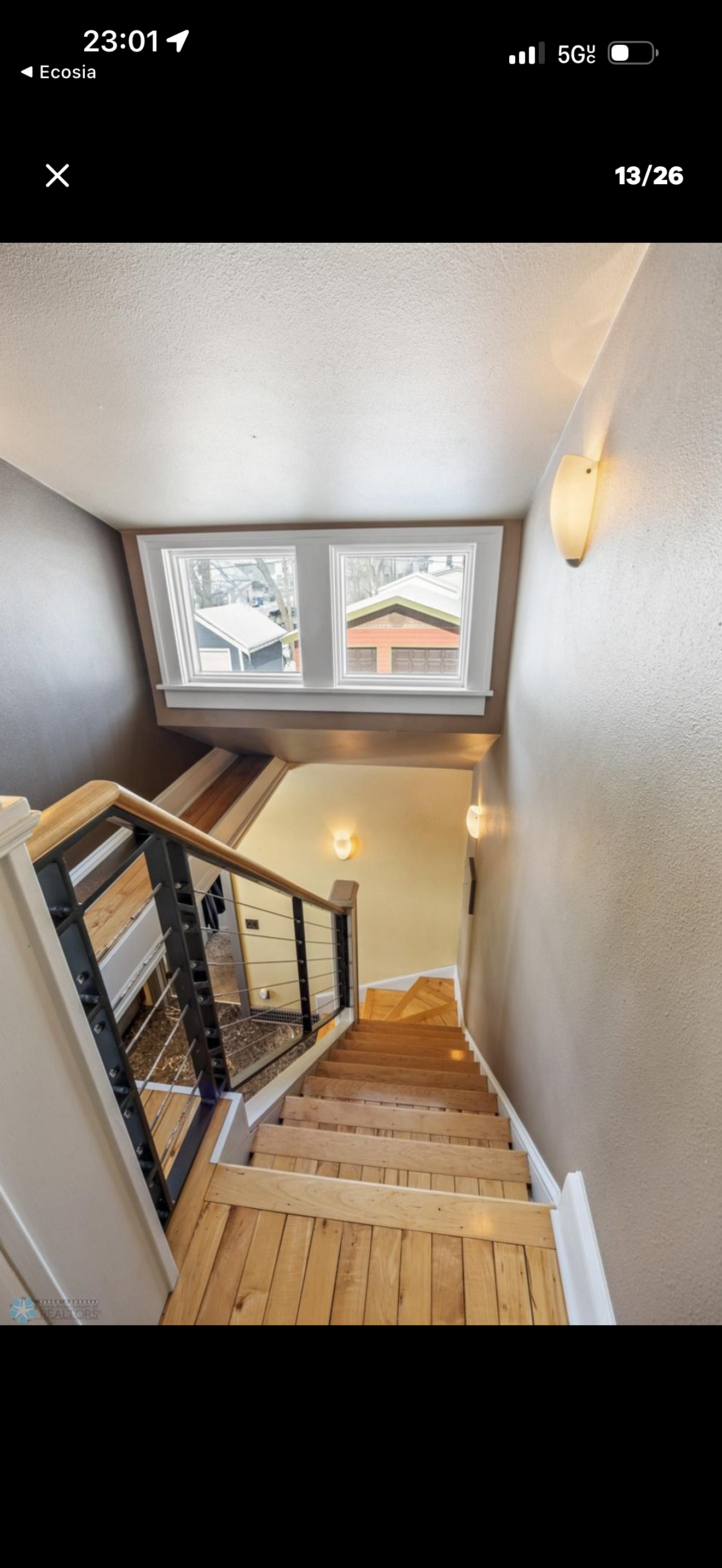 Miscellaneous — stairwell with modern cable railing and hardwood treads