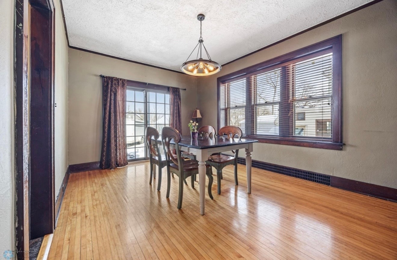 The Hartley Residence — dining room with hardwood floors and pendant lighting